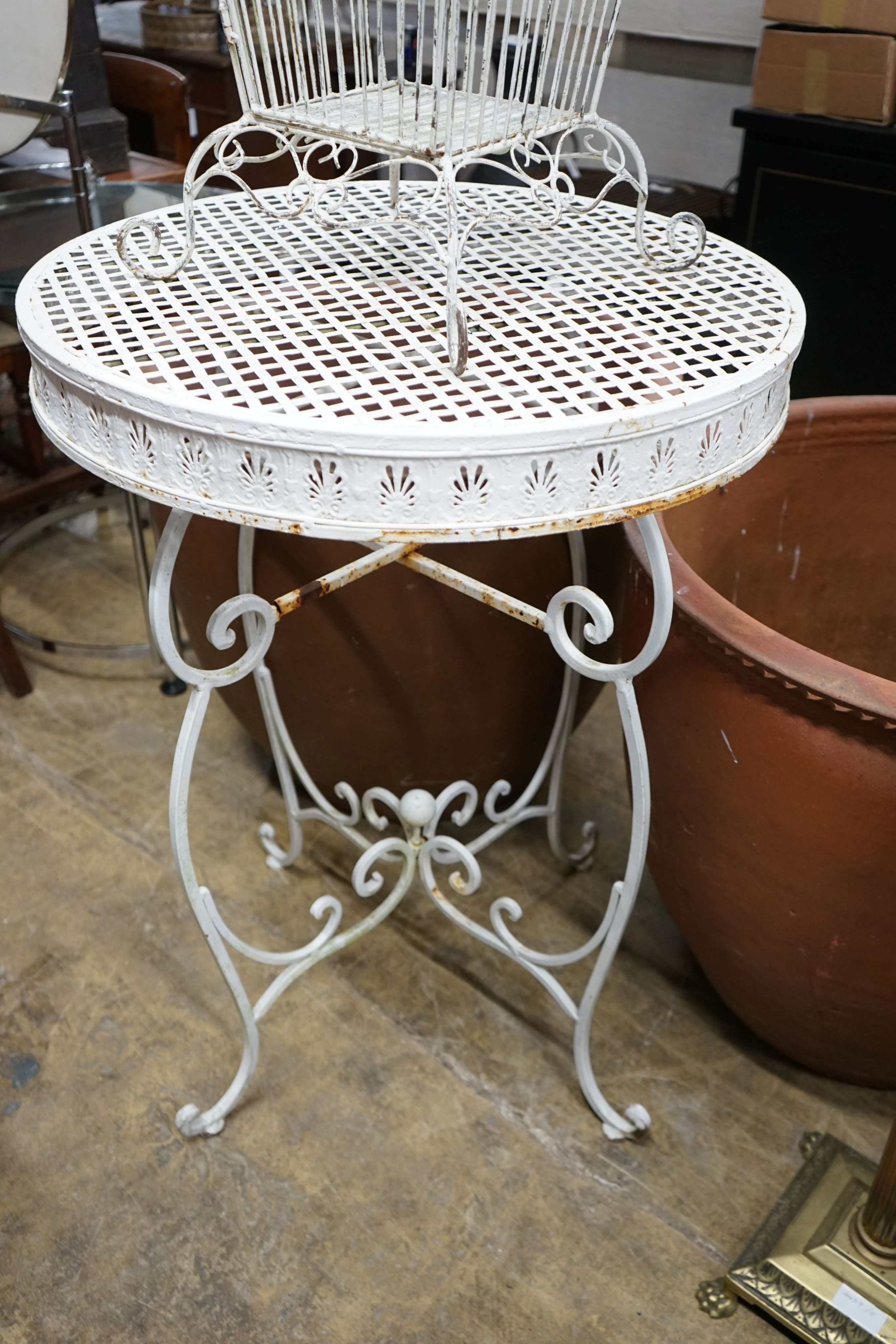 A white painted wirework birdcage, height 110cm together with a painted metal garden bar table